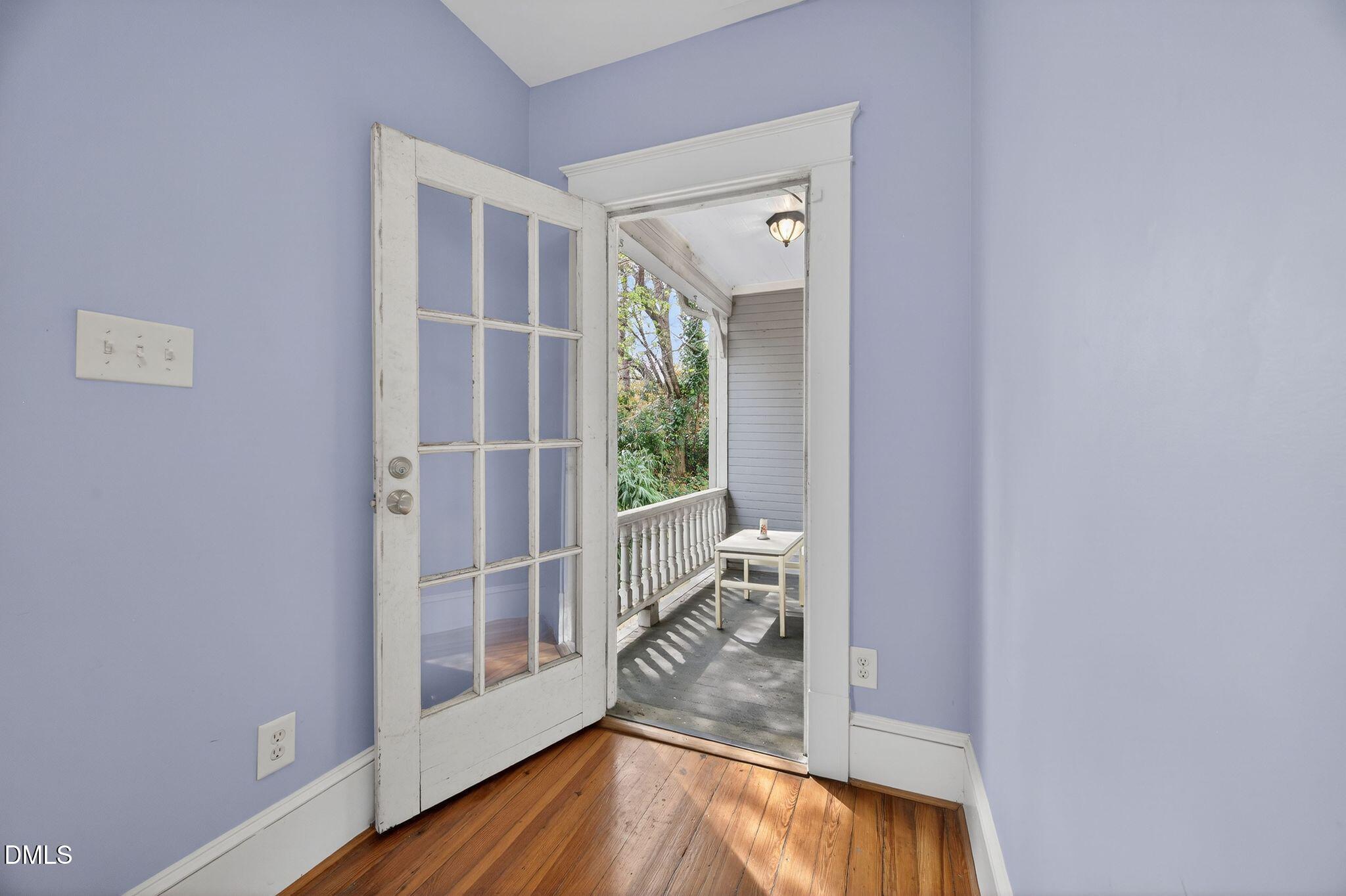 218 Pace Street Raleigh, NC 27604 - Photo 33 of 41 a view of a livingroom with wooden floor and front door