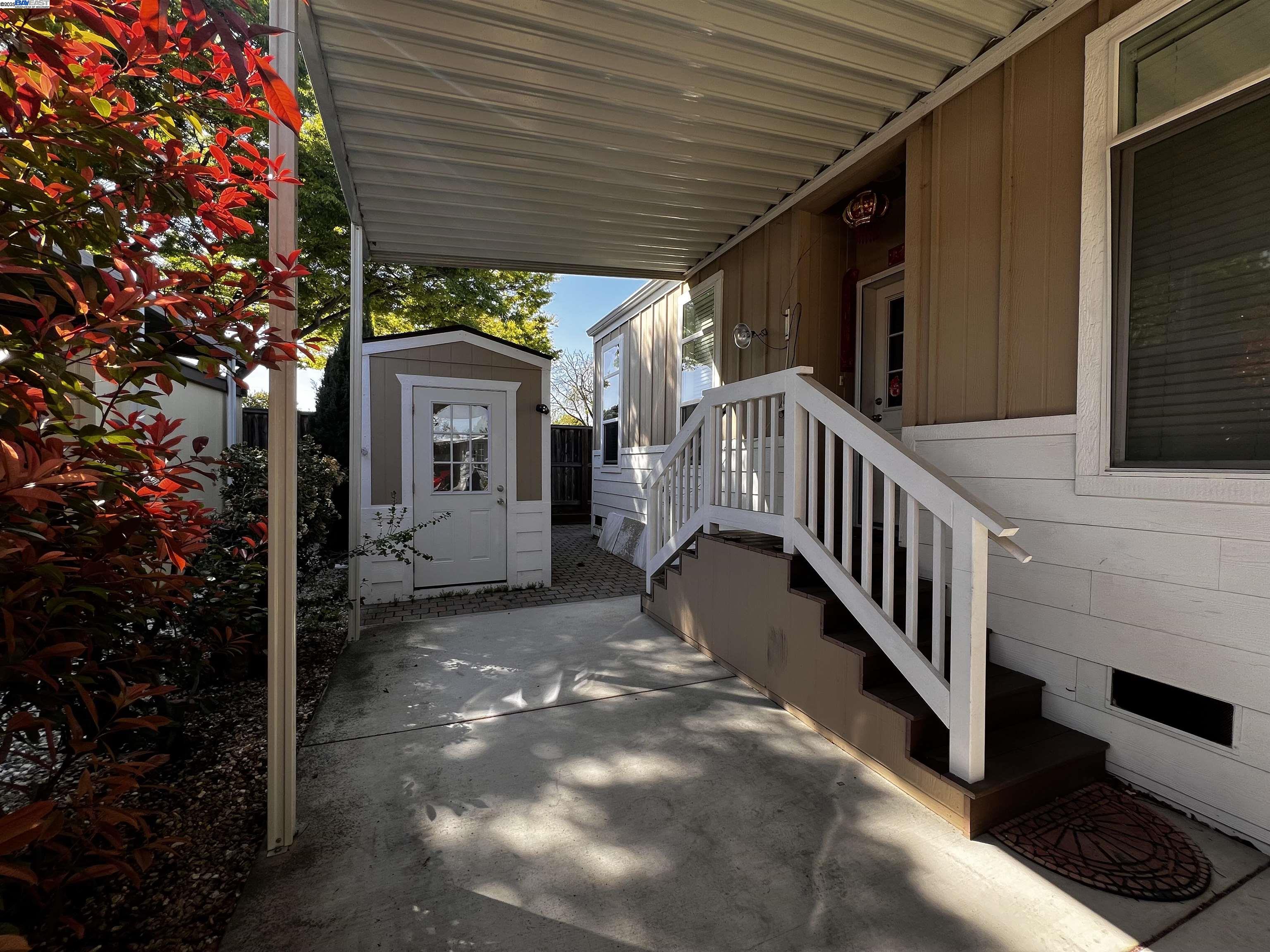 1050 Borregas Avenue, Unit 1 Sunnyvale, CA 94089 - Photo 12 of 13 a view of a house with a small yard and floor to ceiling window