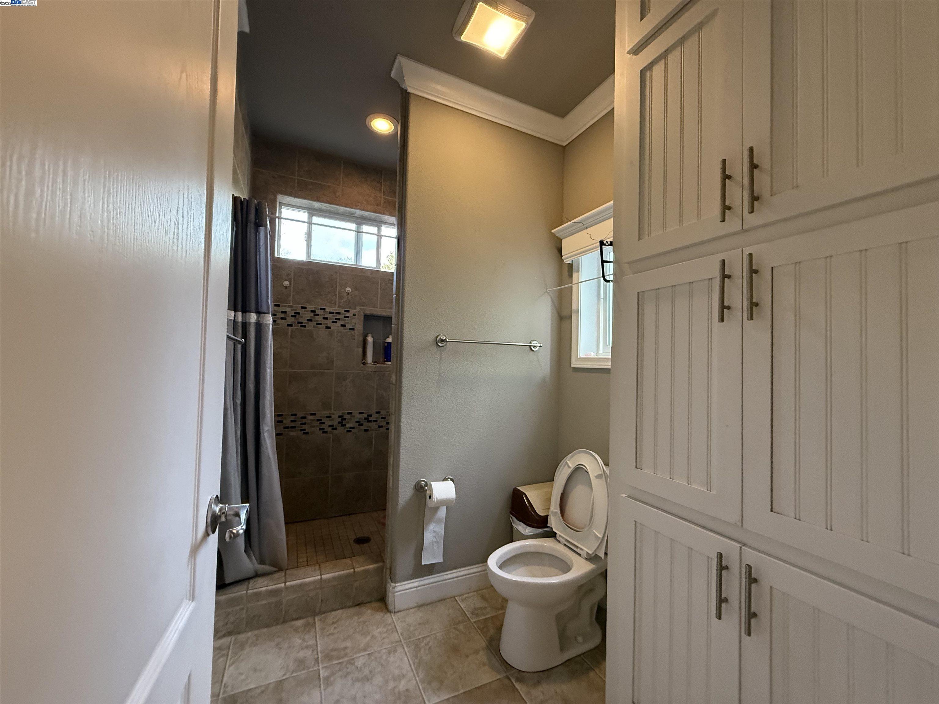 1050 Borregas Avenue, Unit 1 Sunnyvale, CA 94089 - Photo 8 of 13 a bathroom with a toilet and shower