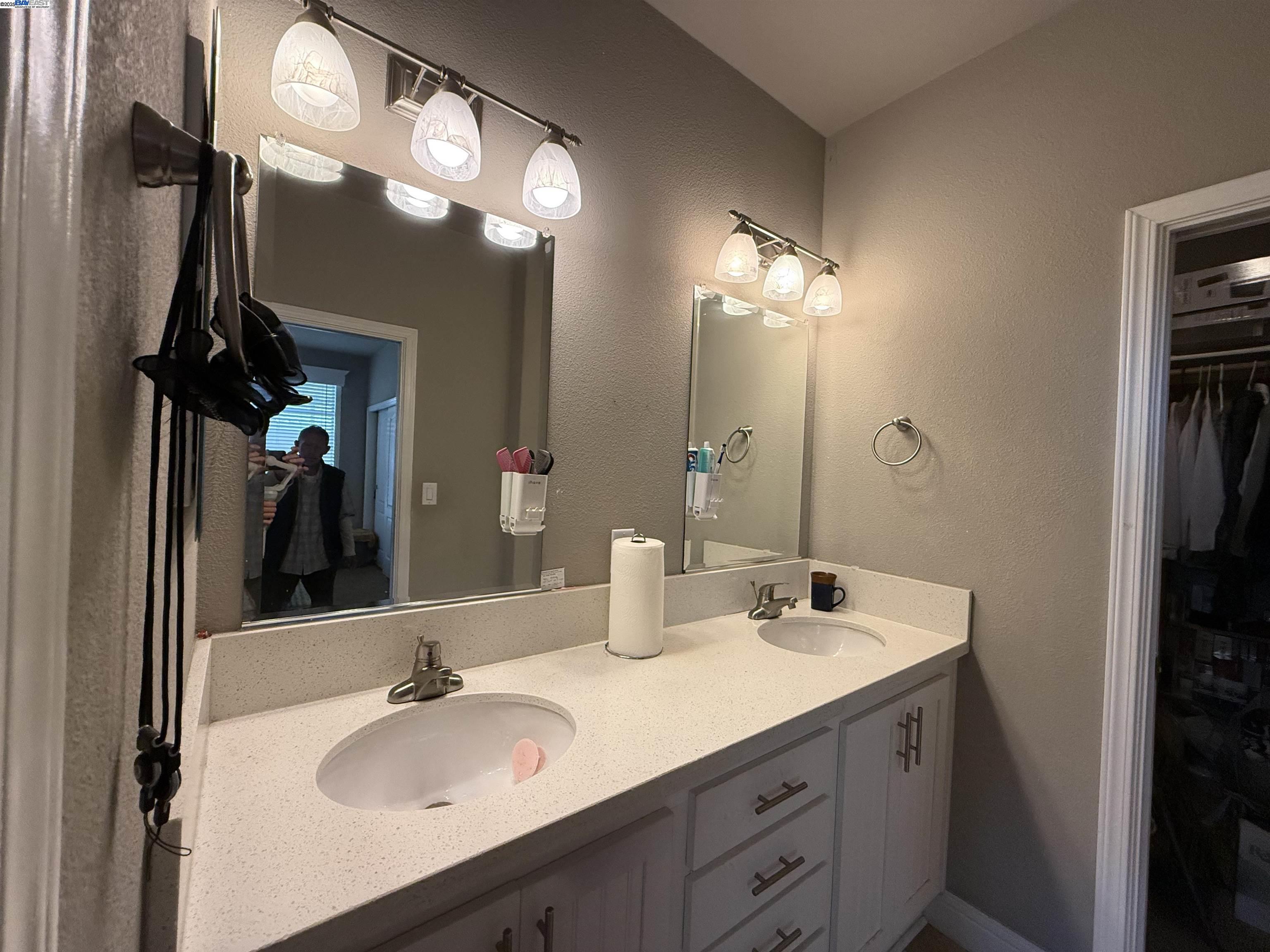 1050 Borregas Avenue, Unit 1 Sunnyvale, CA 94089 - Photo 9 of 13 a bathroom with a sink double vanity and a mirror