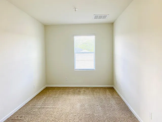 a view of a room that has a window in it
