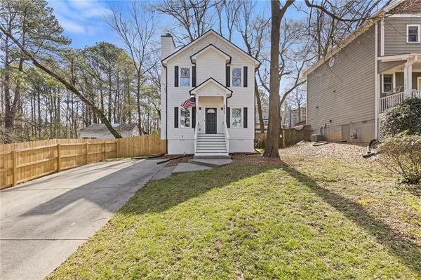 a front view of a house with a yard