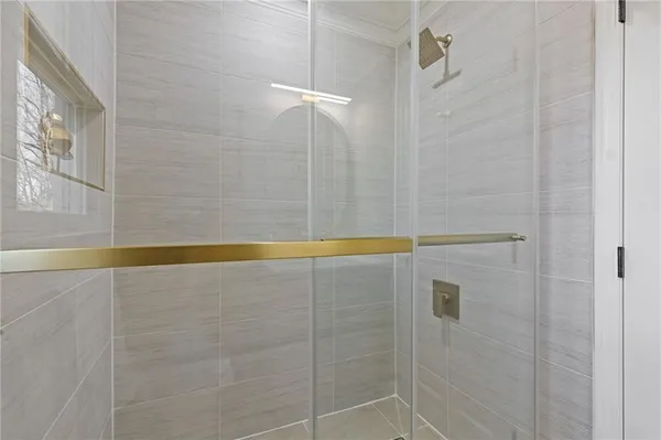 a bathroom with a bathtub and a shower