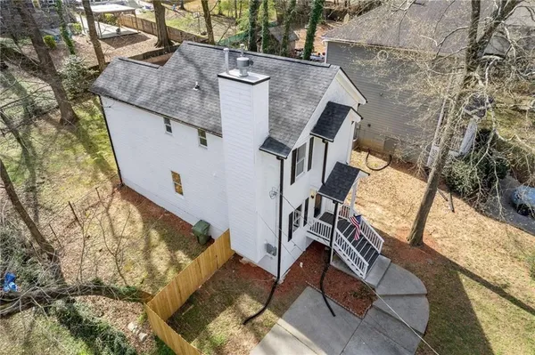 an aerial view of a house with outdoor space