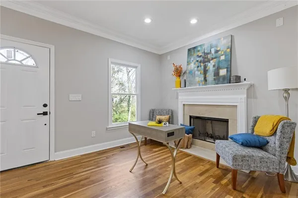a living room with furniture and a fireplace