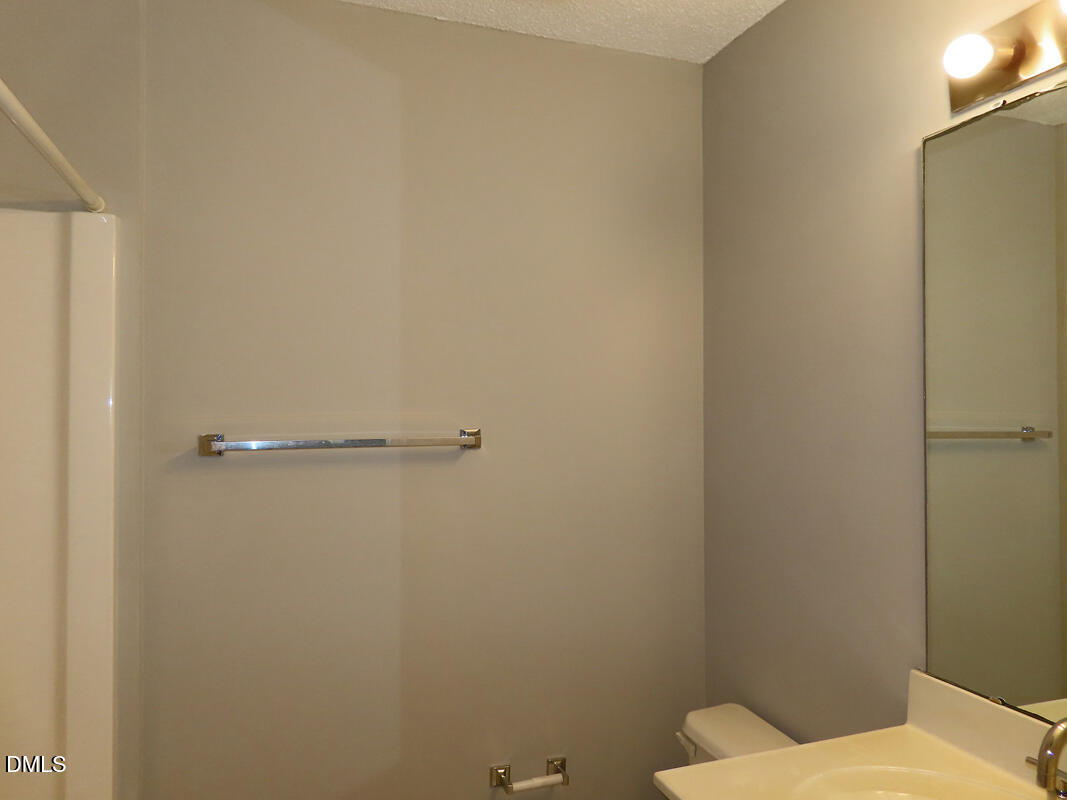 303 Smith Level Road, Unit B31 Chapel Hill, NC 27516 - Photo 11 of 20 a bathroom with a toilet and a shower