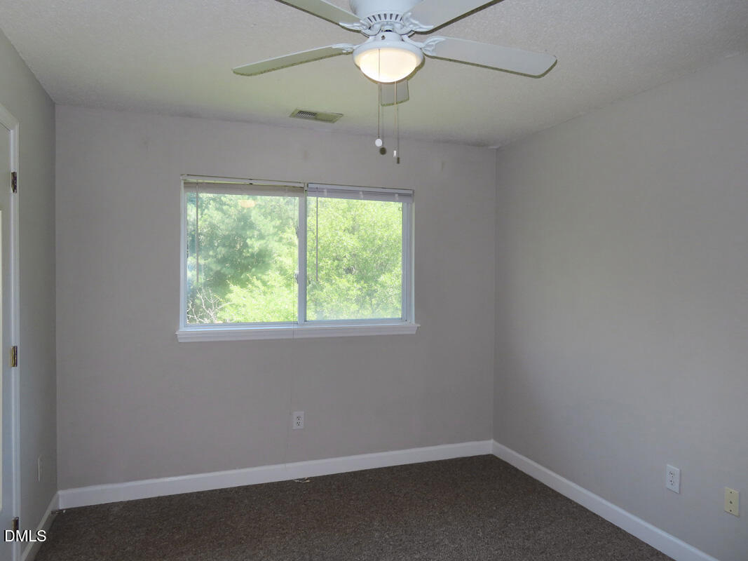 303 Smith Level Road, Unit B31 Chapel Hill, NC 27516 - Photo 12 of 20 an empty room with a window