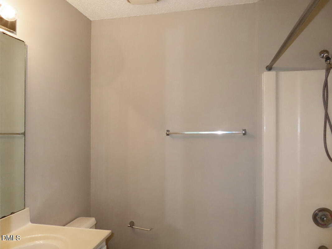 303 Smith Level Road, Unit B31 Chapel Hill, NC 27516 - Photo 15 of 20 a white toilet sitting next to a shower