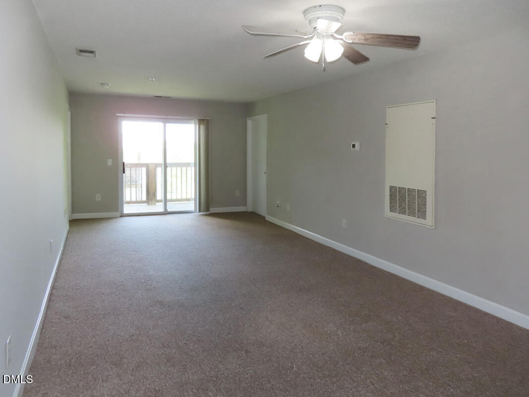 303 Smith Level Road, Unit B31 Chapel Hill, NC 27516 - Photo 4 of 20 a view of an empty room with a window