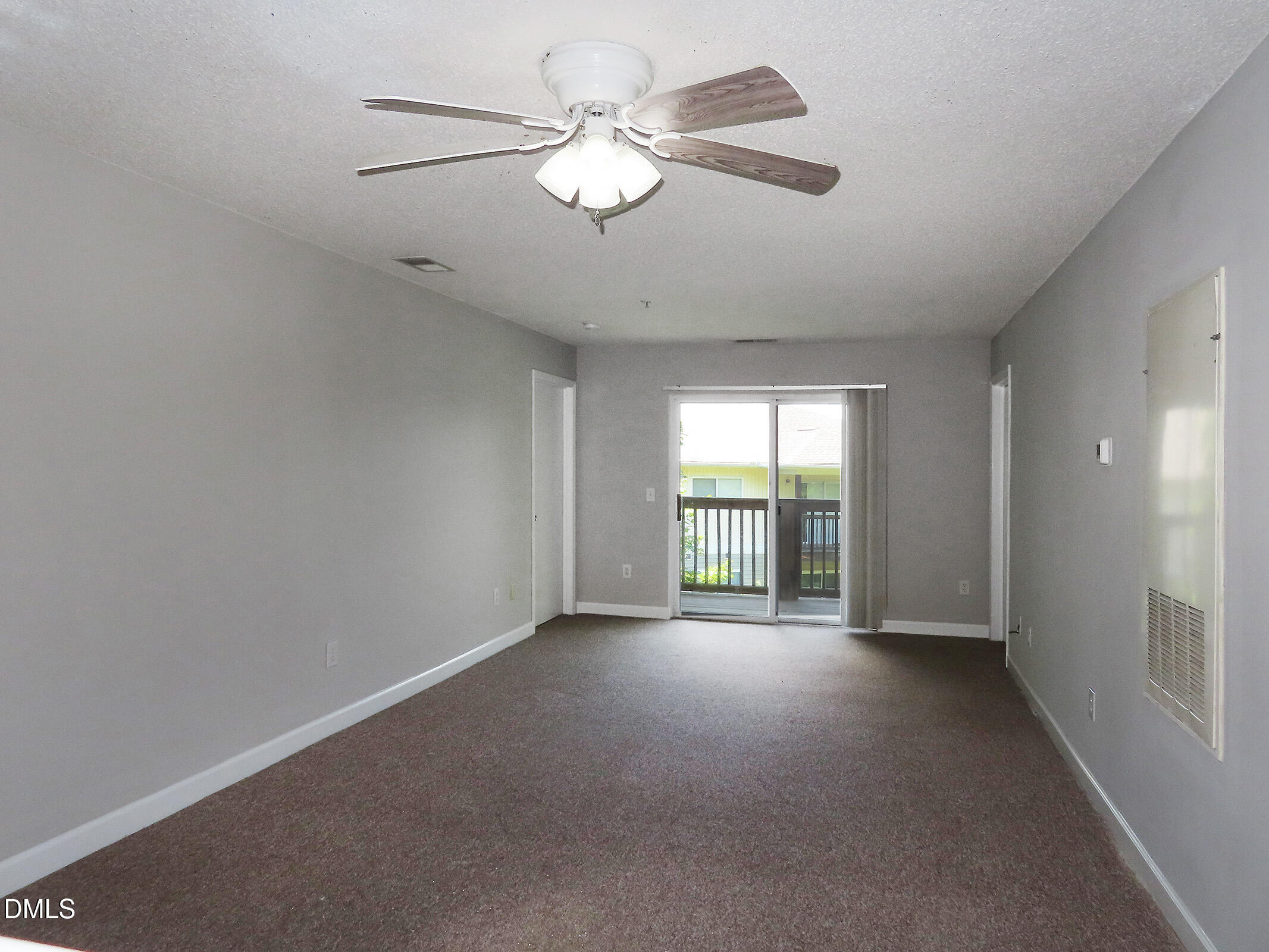 303 Smith Level Road, Unit B31 Chapel Hill, NC 27516 - Photo 5 of 20 a view of an empty room with a window