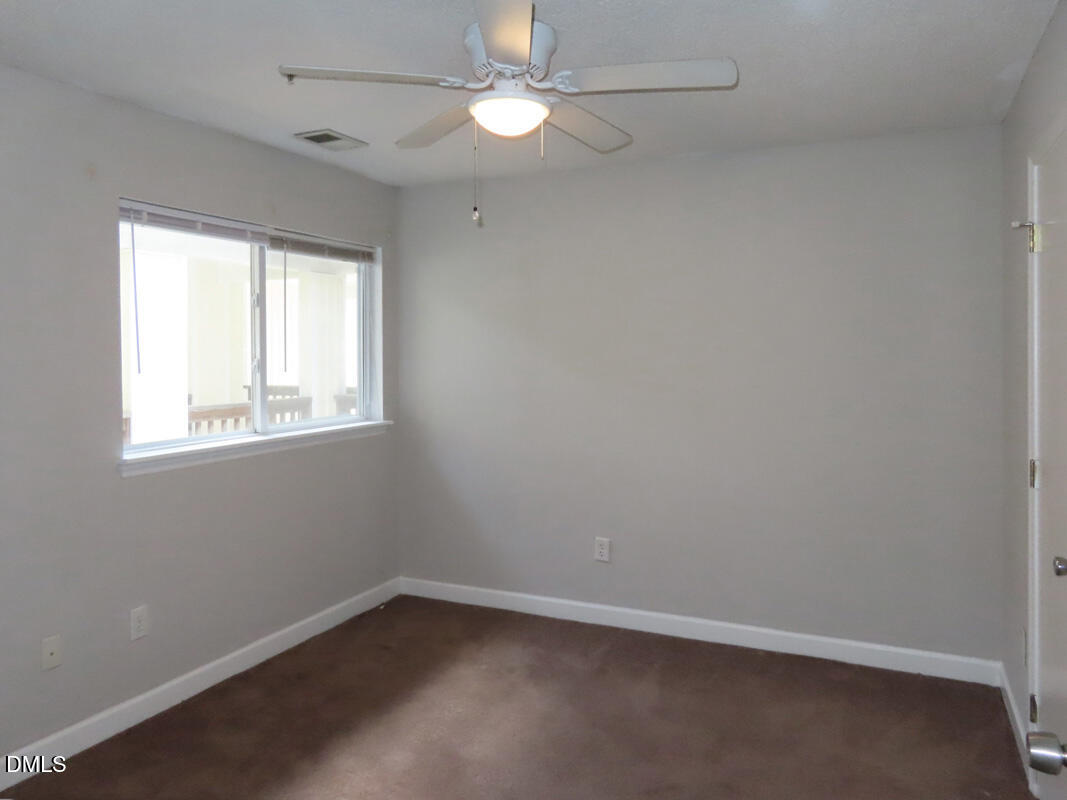303 Smith Level Road, Unit B31 Chapel Hill, NC 27516 - Photo 10 of 20 an empty room with a window