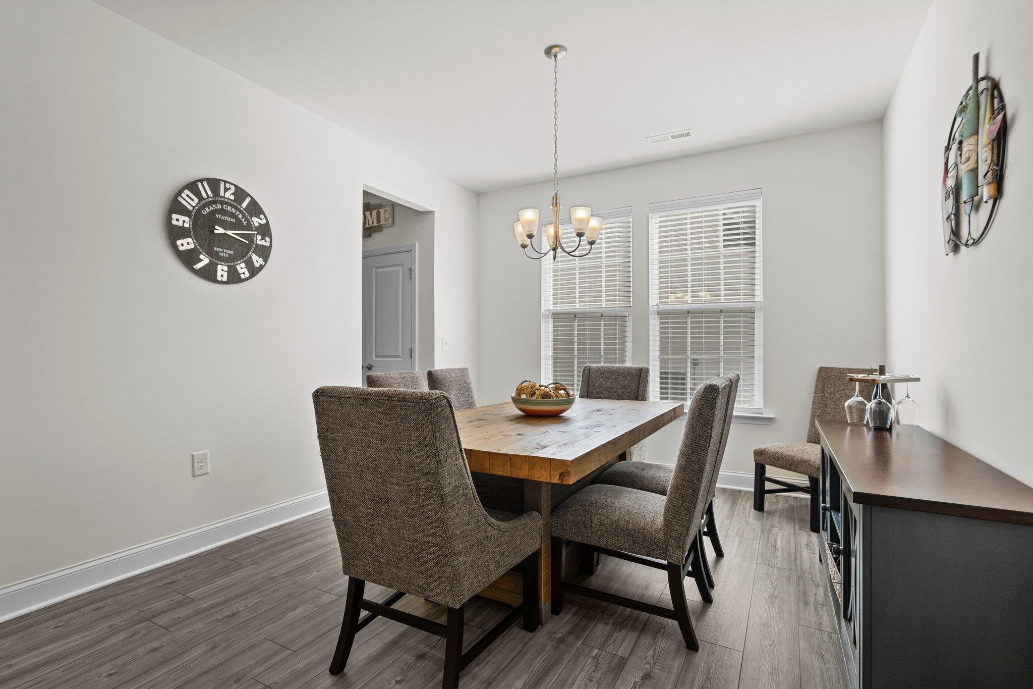 816 Heartpine Drive Mebane, NC 27302 - Photo 11 of 56 a view of a dining room with furniture window and wooden floor