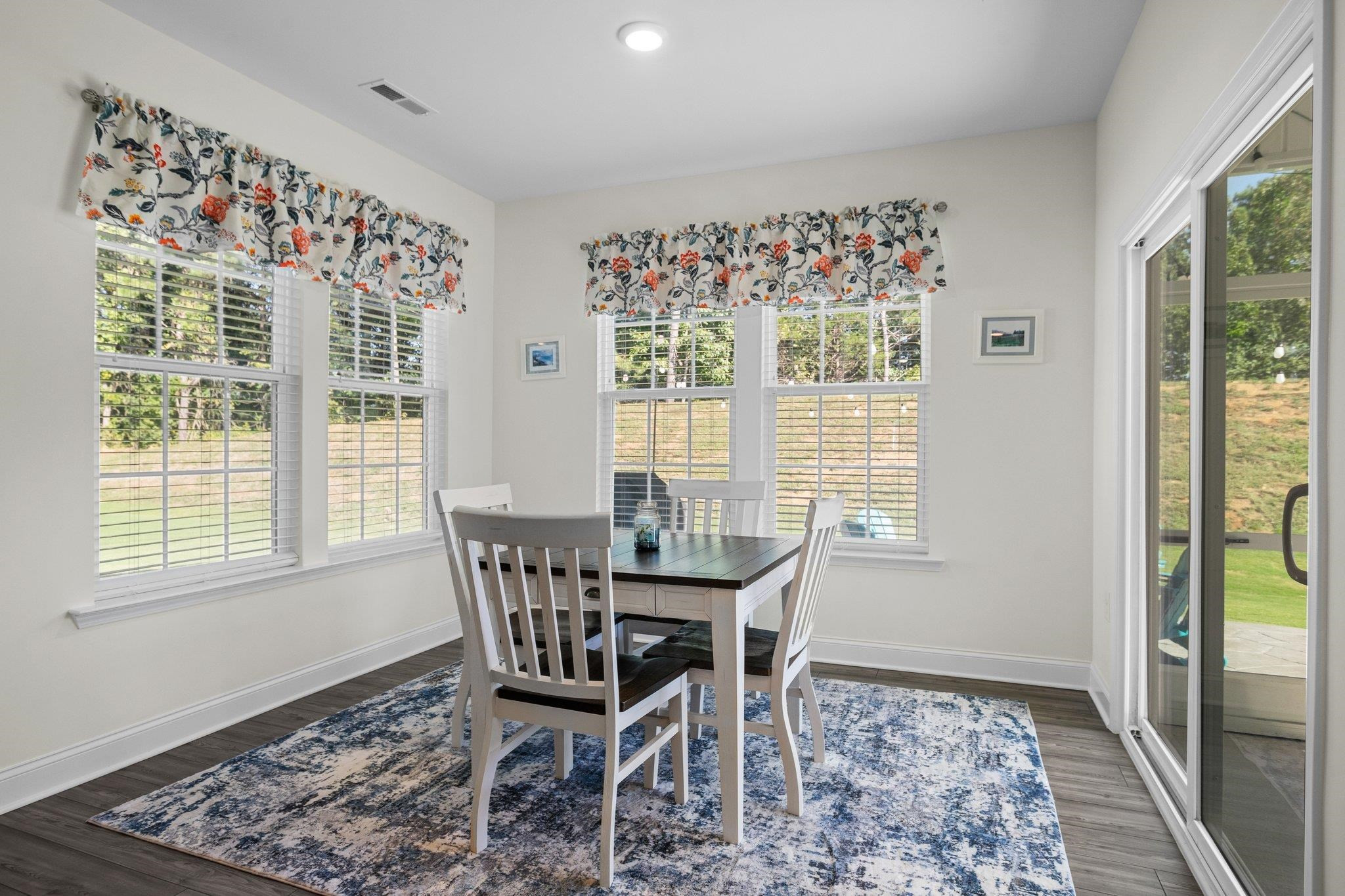 816 Heartpine Drive Mebane, NC 27302 - Photo 21 of 56 a view of a dining room with furniture window and outside view