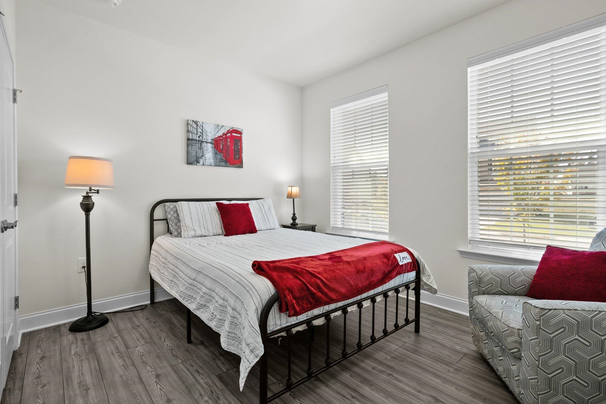 816 Heartpine Drive Mebane, NC 27302 - Photo 22 of 56 a bedroom with a bed and wooden floor