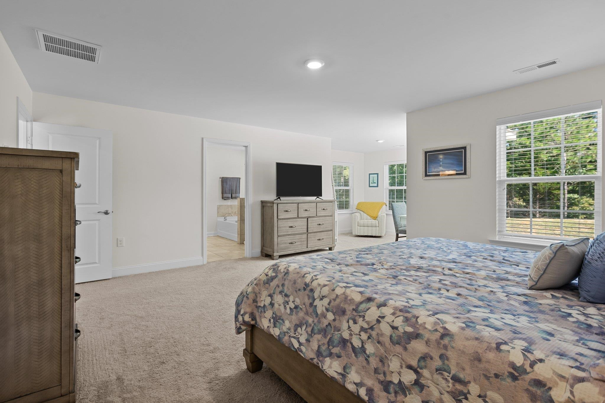 816 Heartpine Drive Mebane, NC 27302 - Photo 29 of 56 a large bedroom with a bed and flat screen tv