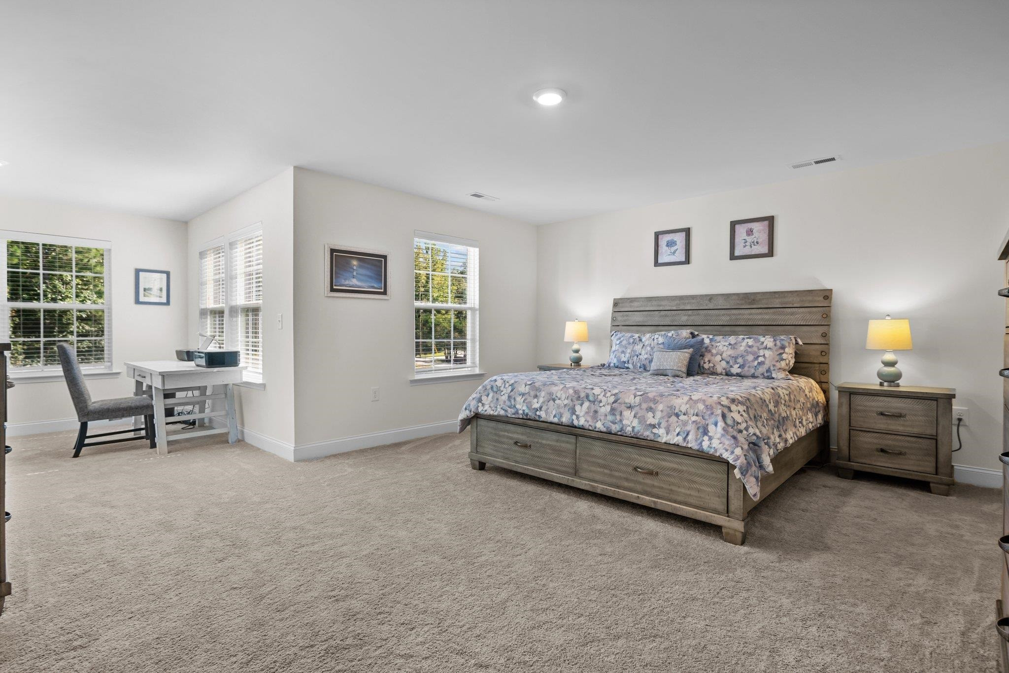 816 Heartpine Drive Mebane, NC 27302 - Photo 30 of 56 a bedroom with a large bed a table and chair