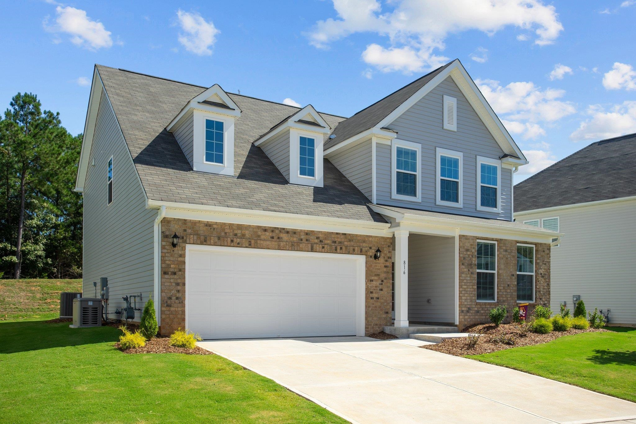 816 Heartpine Drive Mebane, NC 27302 - Photo 3 of 56 a front view of a house with garden