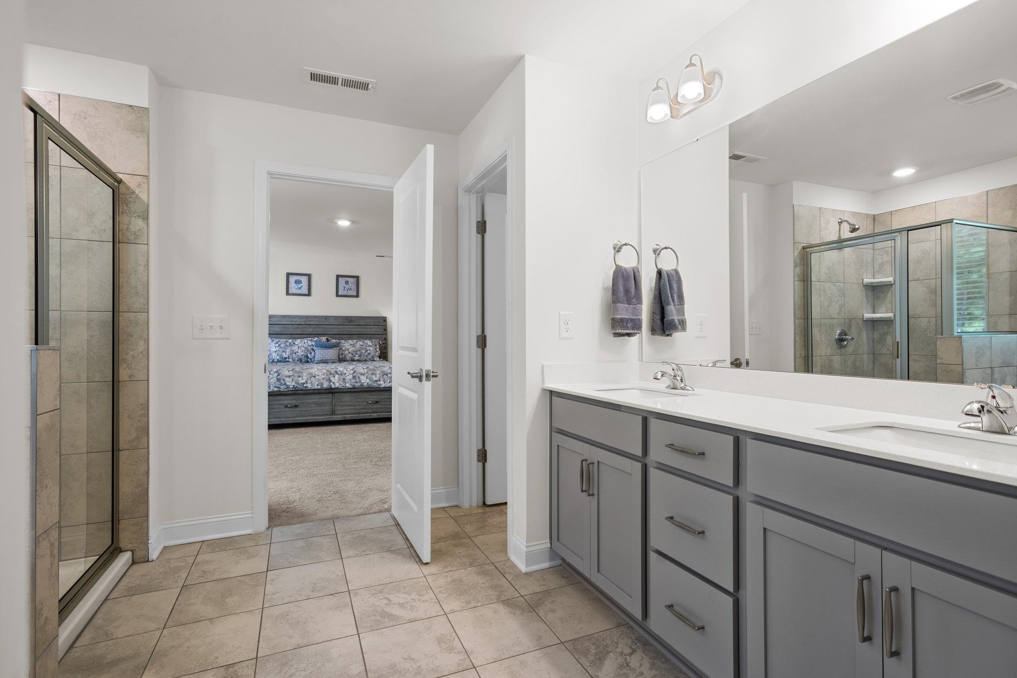 816 Heartpine Drive Mebane, NC 27302 - Photo 35 of 56 a spacious bathroom with a granite countertop sink mirror and shower