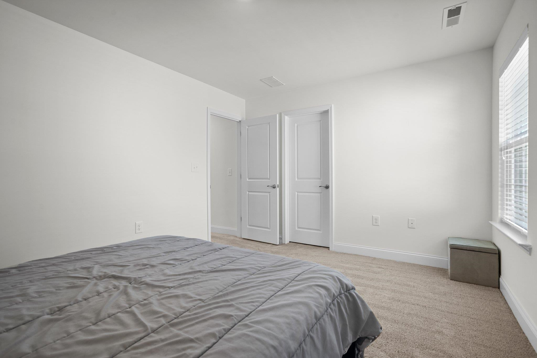816 Heartpine Drive Mebane, NC 27302 - Photo 40 of 56 a bedroom with a bed and a couch
