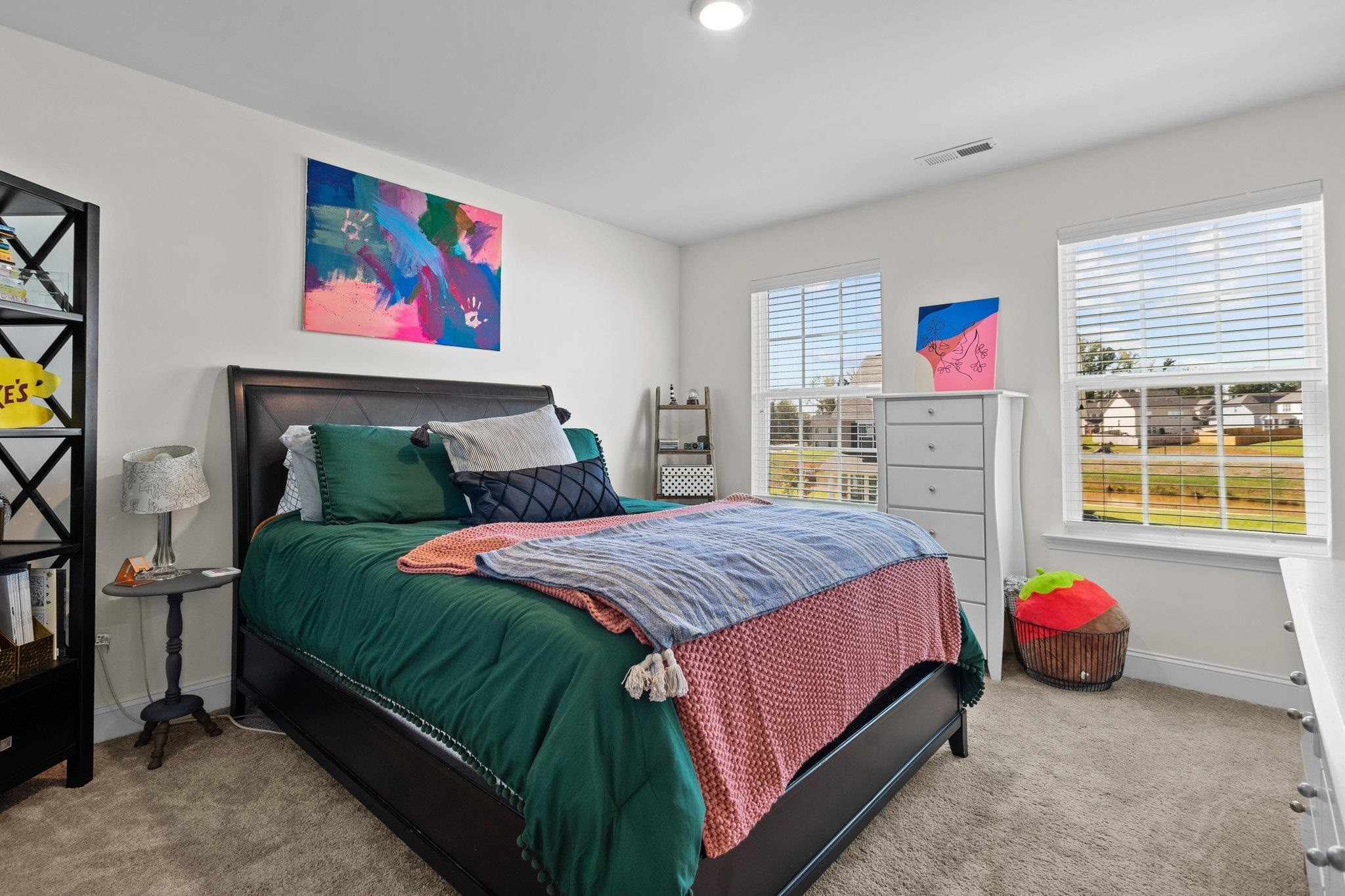 816 Heartpine Drive Mebane, NC 27302 - Photo 41 of 56 a bedroom with a bed and wooden floor