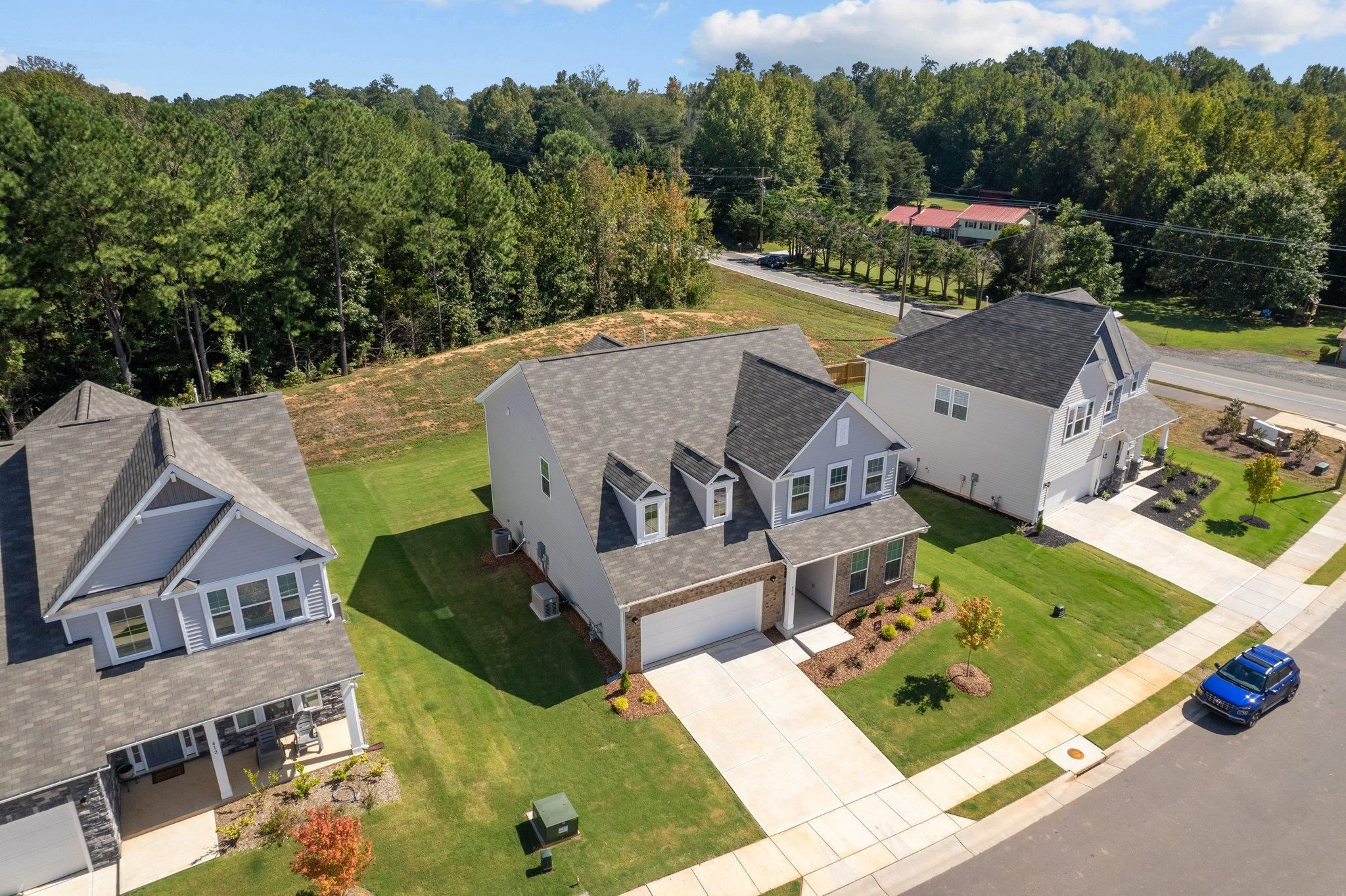 816 Heartpine Drive Mebane, NC 27302 - Photo 6 of 56 an aerial view of a house with a garden