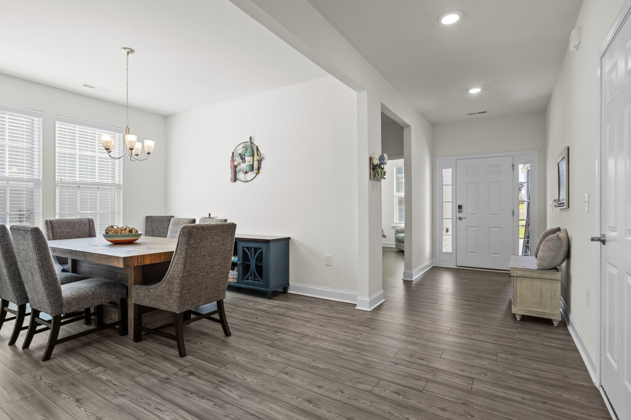 816 Heartpine Drive Mebane, NC 27302 - Photo 10 of 56 a view of a dining room with furniture and wooden floor