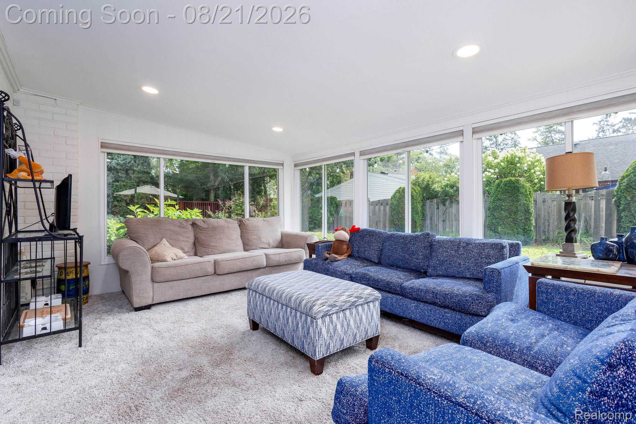 416 Barclay Road Grosse Pointe, MI 48236 - Photo 15 of 34 Expansive sunroom with multiple large windows, recessed ceiling lights, and white painted brick wall
