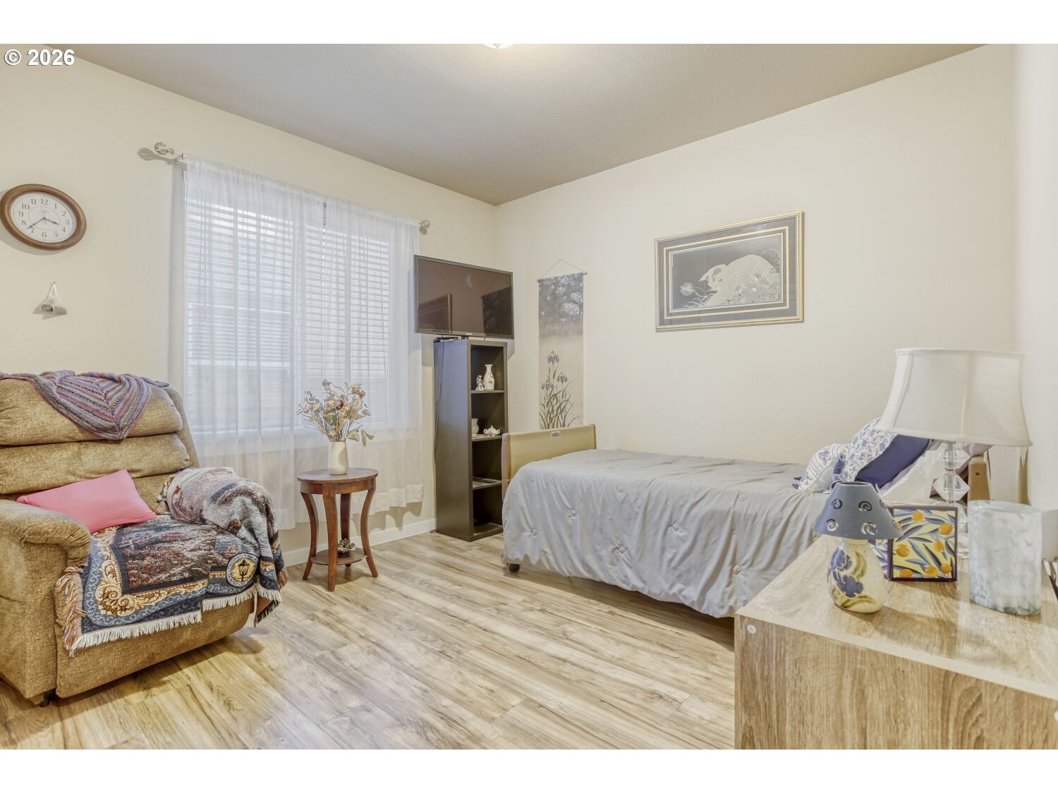 20845 Southwest Eggert Way Beaverton, OR 97078 - Photo 12 of 28 a bedroom with a bed and wooden floor