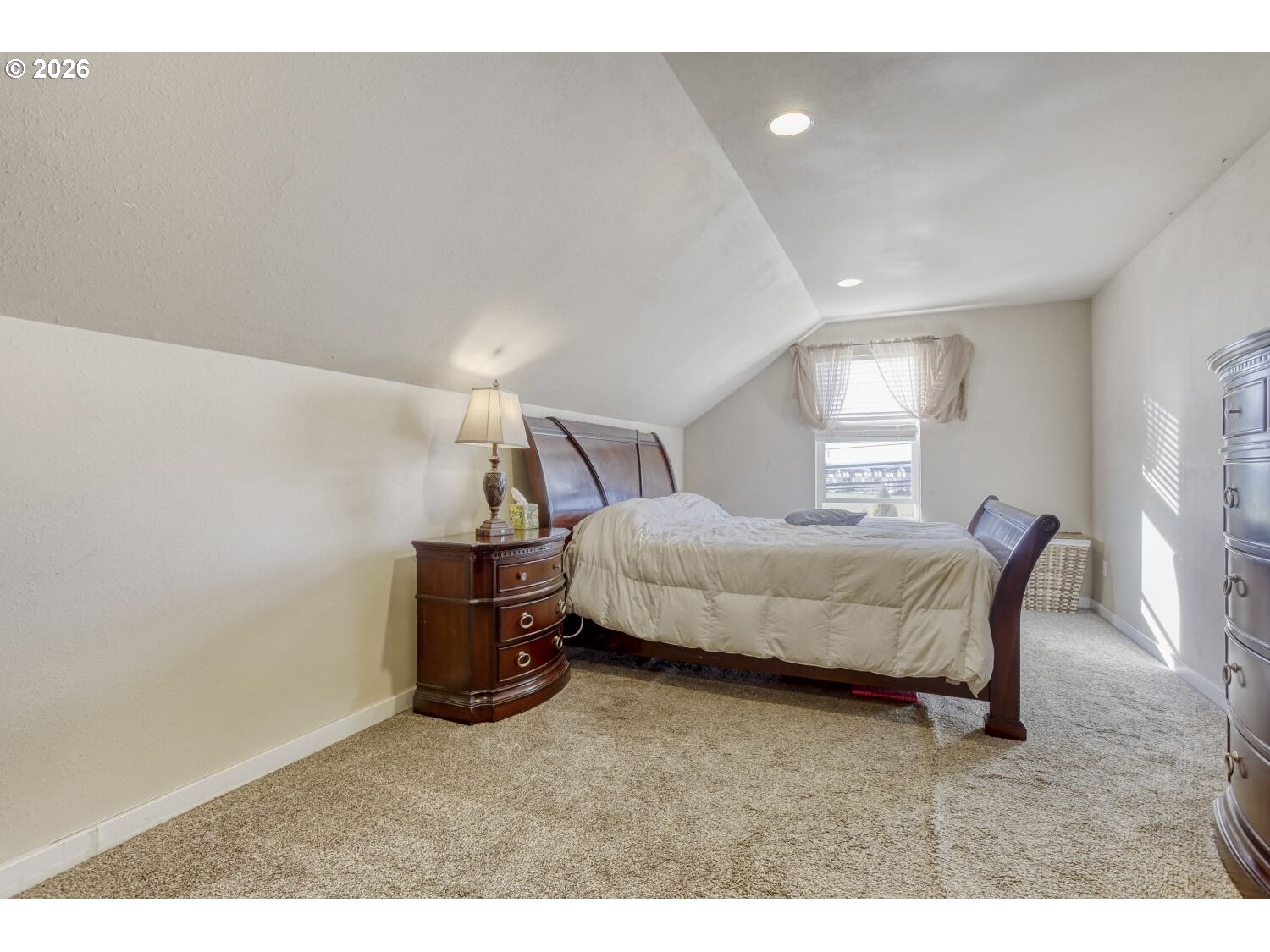 20845 Southwest Eggert Way Beaverton, OR 97078 - Photo 17 of 28 a bedroom with a bed and a night stand