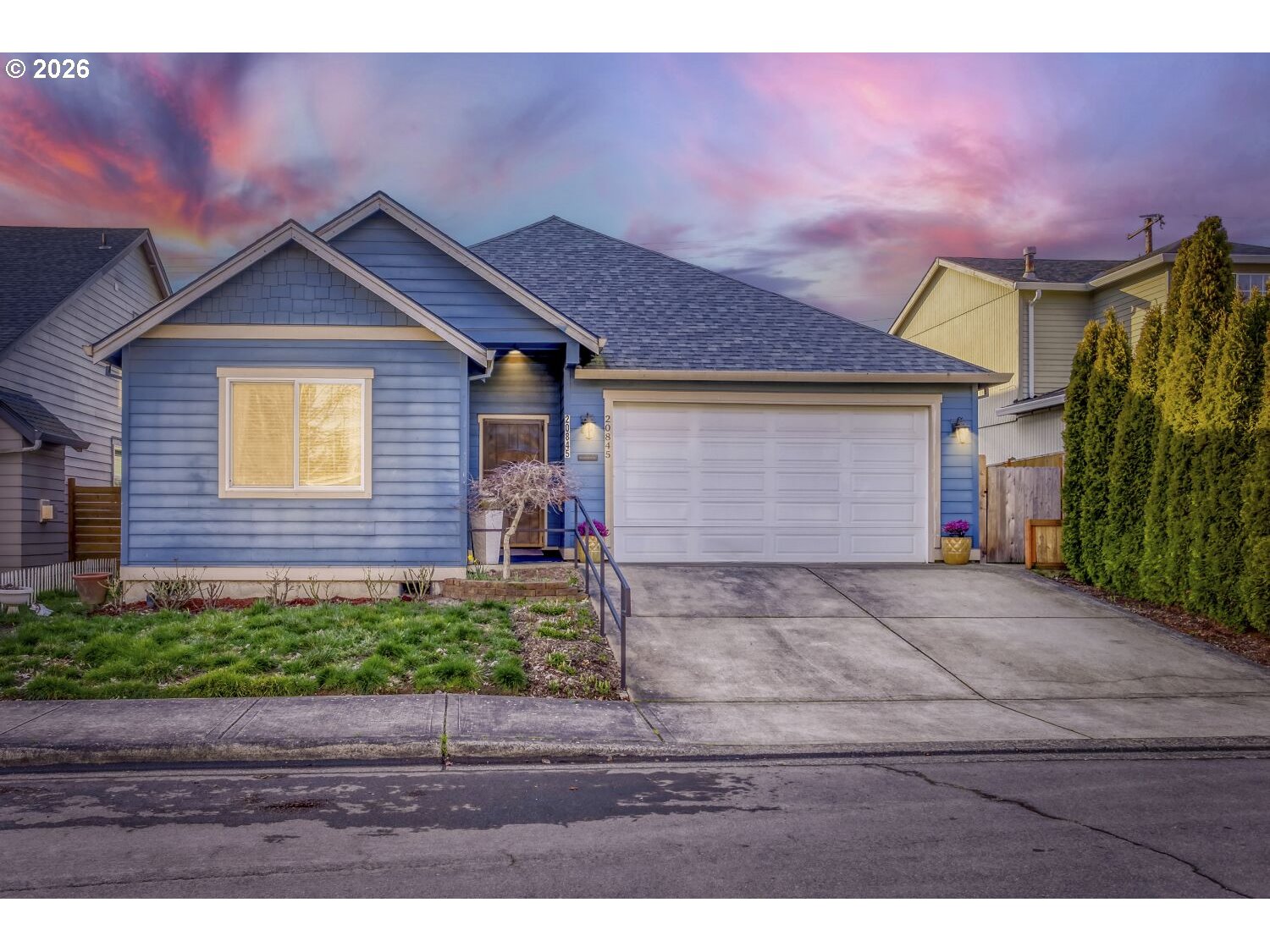 20845 Southwest Eggert Way Beaverton, OR 97078 - Photo 28 of 28 a front view of a house with a yard and garage
