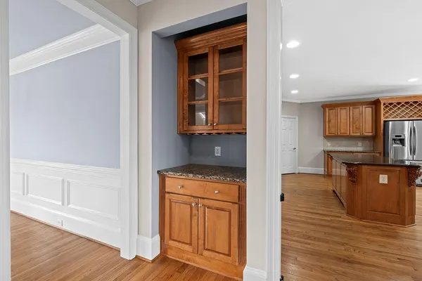 a kitchen with stainless steel appliances granite countertop a sink stove and cabinets