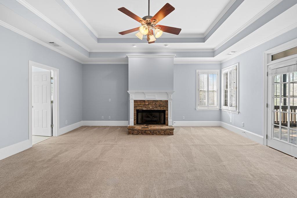 1037 Windermere Crossing Cumming, GA 30041 - Photo 37 of 95 a view of an empty room with window and fireplace