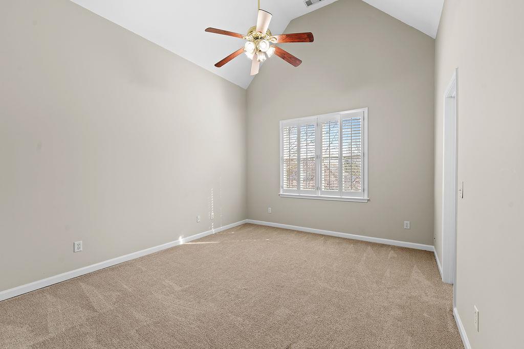 1037 Windermere Crossing Cumming, GA 30041 - Photo 47 of 95 an empty room with a window and a fan