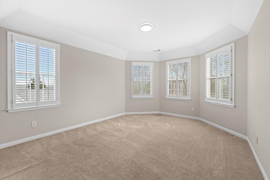 1037 Windermere Crossing Cumming, GA 30041 - Photo 56 of 95 a view of an empty room with a window