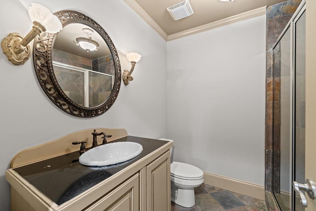 1037 Windermere Crossing Cumming, GA 30041 - Photo 78 of 95 a bathroom with a sink and a mirror