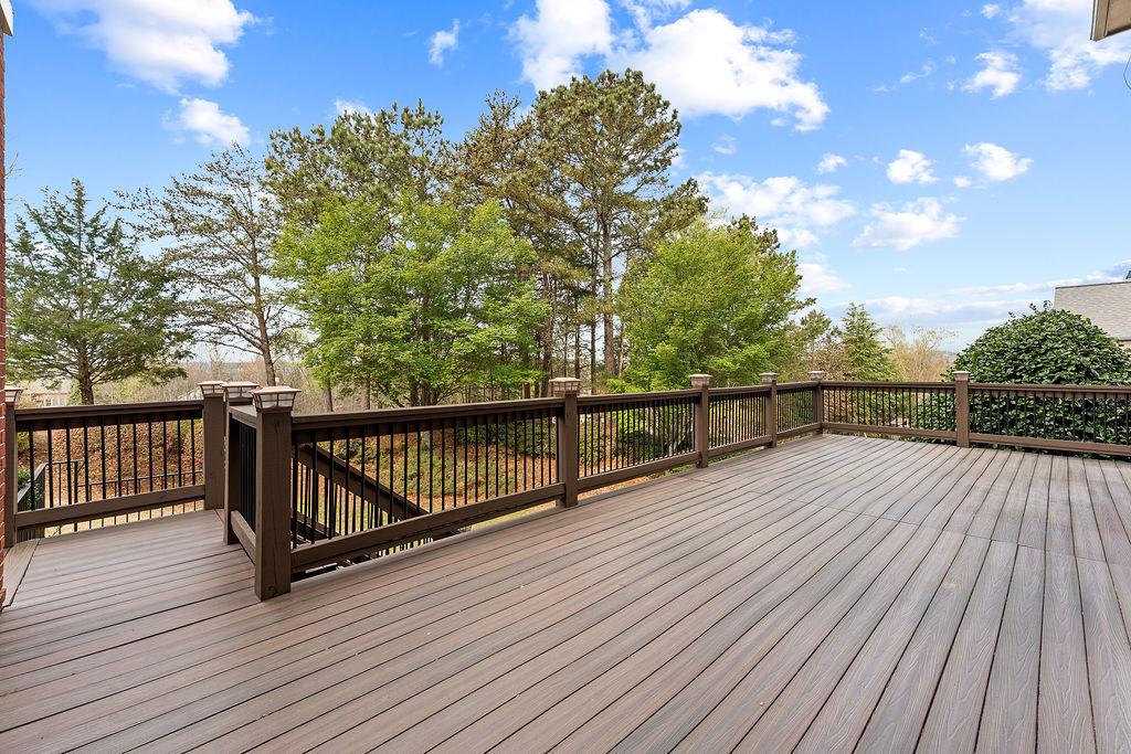 1037 Windermere Crossing Cumming, GA 30041 - Photo 81 of 95 a view of deck with wooden floor and fence