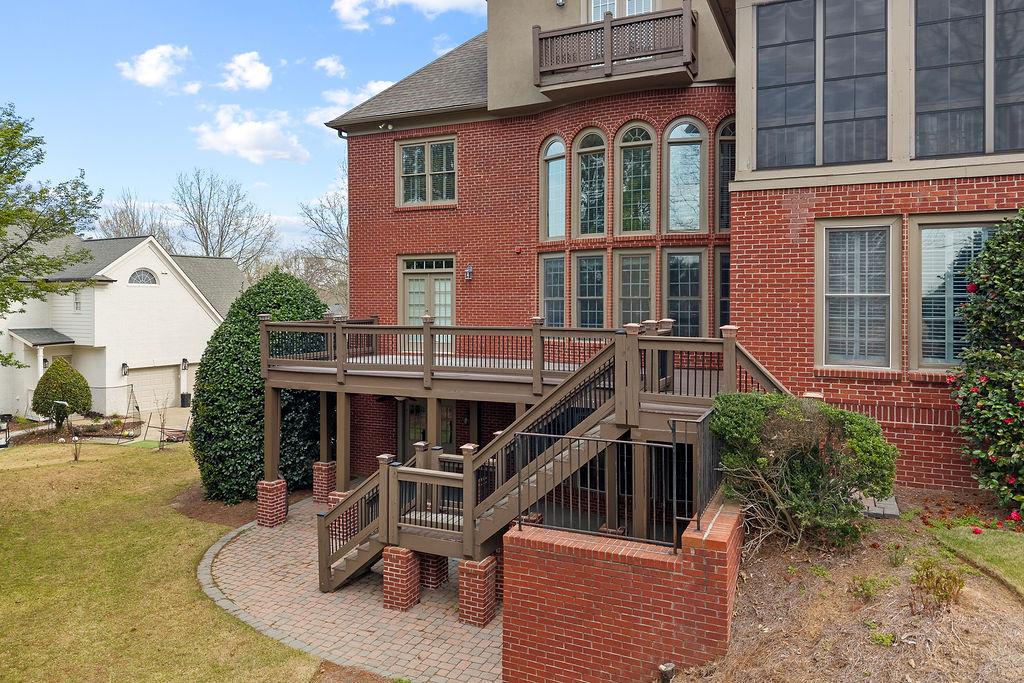 1037 Windermere Crossing Cumming, GA 30041 - Photo 84 of 95 front view of a house with a small yard