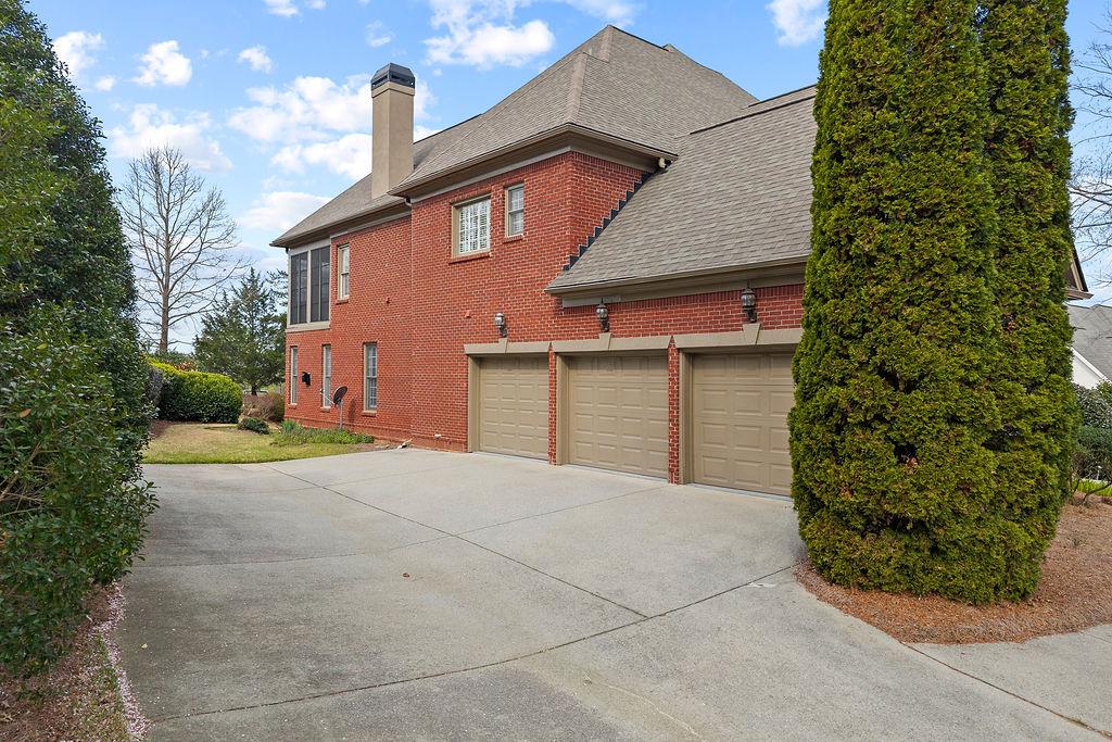 1037 Windermere Crossing Cumming, GA 30041 - Photo 88 of 95 front view of a house with a garage