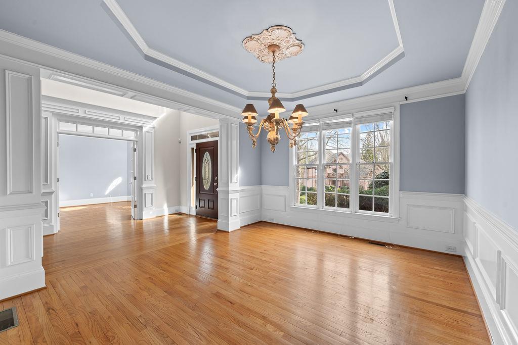 1037 Windermere Crossing Cumming, GA 30041 - Photo 10 of 95 a view of an empty room with window and wooden floor