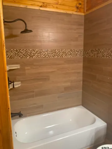 a bathroom with a bathtub