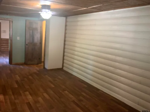 a view of a room with stairs and wooden floor