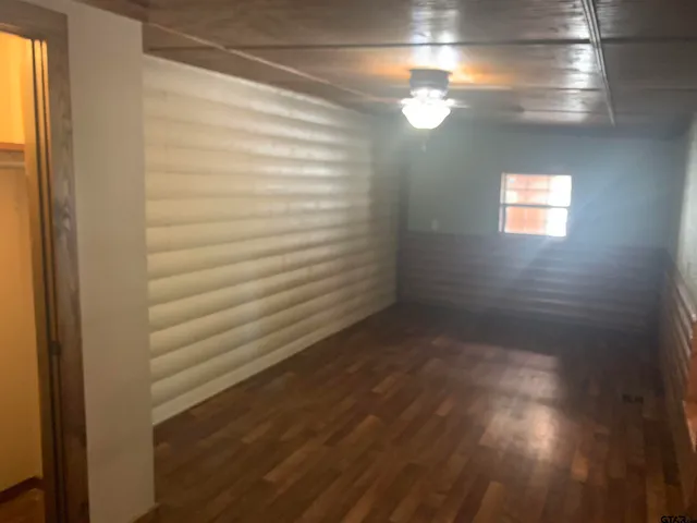 a view of room with window and stairs