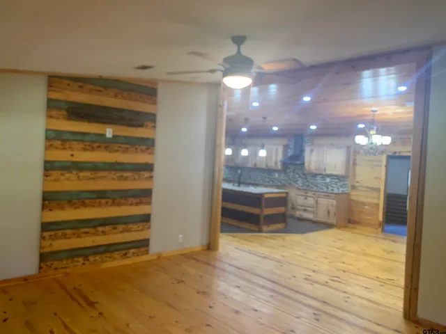 a room with a wooden floor and furniture