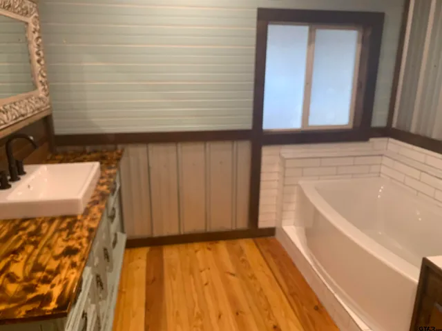 a bathroom with a sink and a bathtub