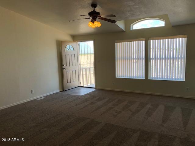 16318 Squatter Road Arizona City, AZ 85123 - Photo 2 of 26 Living room with carpet