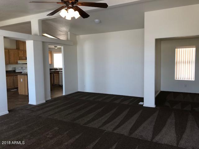 16318 Squatter Road Arizona City, AZ 85123 - Photo 4 of 26 Front room to kitchen