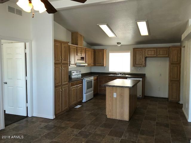 16318 Squatter Road Arizona City, AZ 85123 - Photo 7 of 26 Oak finish cabinets
