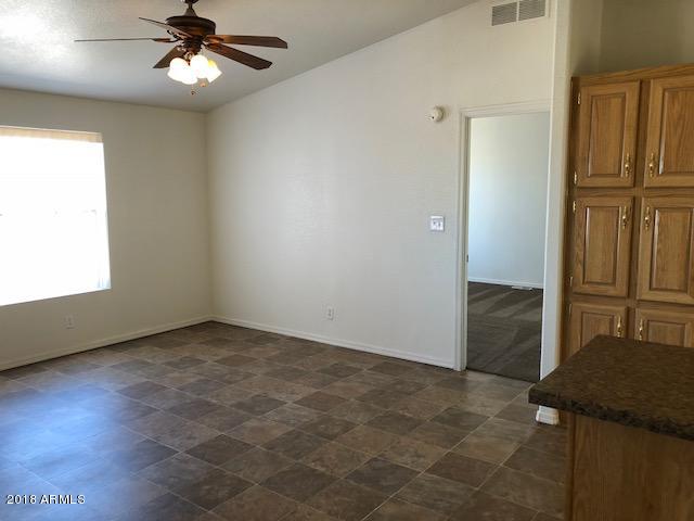 16318 Squatter Road Arizona City, AZ 85123 - Photo 9 of 26 Kitchen eating area leading to Master