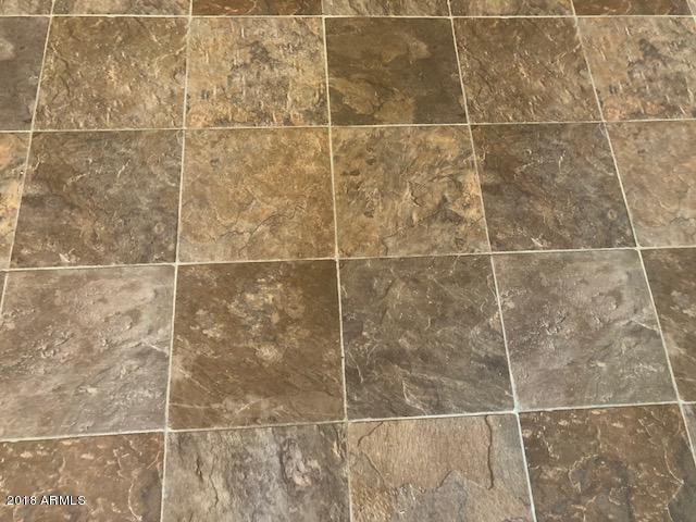 16318 Squatter Road Arizona City, AZ 85123 - Photo 10 of 26 Vinyl flooring in kitchen