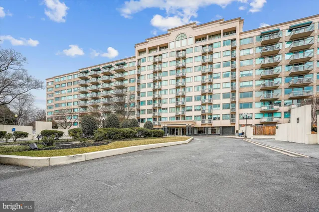 a view of building with streets and trees in the background